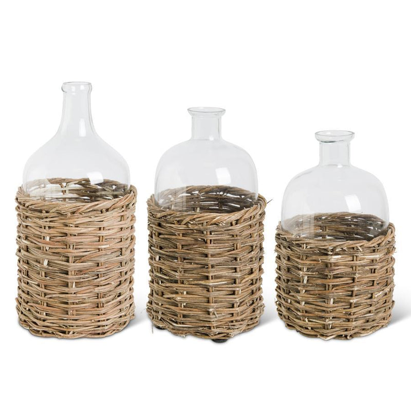 Clear Glass Bottles in Woven Rattan Basket